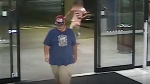 Police have appealed for the man wearing the red baseball cap, blue shirt and glasses to come forward. He can be seen walking into the Underwood Marketplace as the victim runs inside for help after being stabbed.