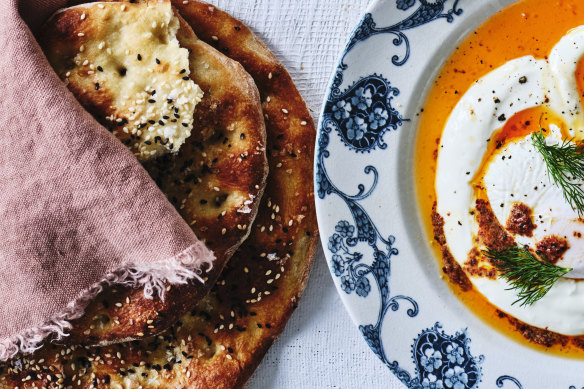 Turkish-style flatbreads (left) and cilbir (poached eggs with yoghurt and chilli butter).