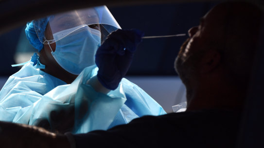 Nurse Menu Caur conducts a test at the North Narrabeen mobile site on Monday.