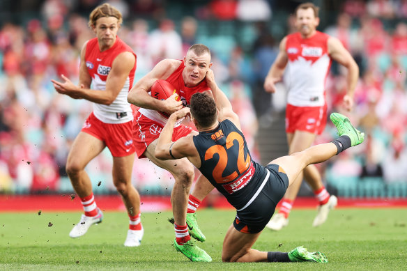 Chad Warner shrugs off the tackle of Josh Kelly.