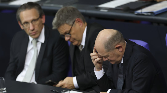 German Chancellor Olaf Scholz (right), Economy and Climate Action Minister Robert Habeck and German Finance Minister Joerg Kukies (left) attend debates before Scholz lost a vote of confidence at the Bundestag.