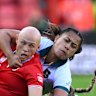 Canada’s Olivia Apps, left, is being brought down by Australia’s players