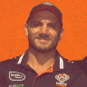 Robbie Farah and the mural dedicated to him at the Sackville Hotel in Rozelle.