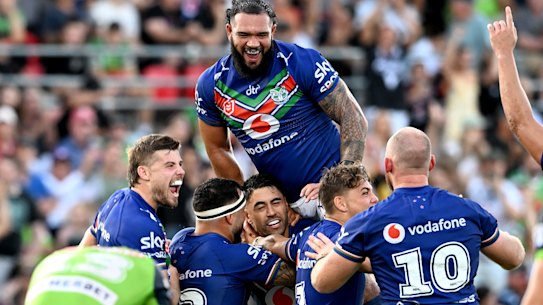 Shaun Johnson is swamped by teammates after his match-winning field goal.