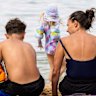 Flat and fancy: Families enjoy Balmoral Beach.