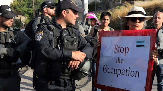Israeli police stand guard at a demonstration in support of Palestinians in Sheikh Jarrah of East Jerusalem, where dozens of families face imminent forcible eviction from their homes by Israeli settlers.