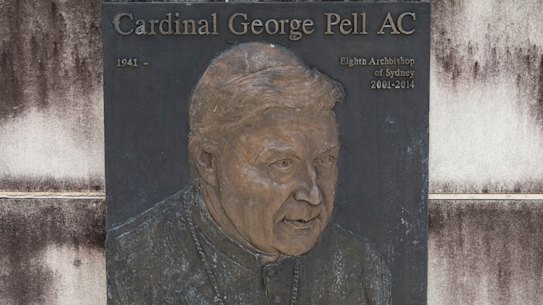 A plaque featuring Cardinal George Pell at Saint Mary’s Cathedral in Sydney.