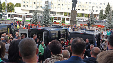People gather for the funerals of five Russian nuclear engineers killed by a rocket explosion in Sarov.