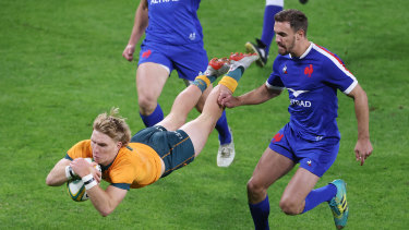 Wallabies halfback Tate McDermott crossed for a five-pointer. 