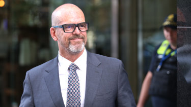 Simon Overland leaving the royal commission on December 18, 2019.