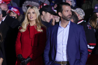 Ivanka Trump and Donald Trump jnr listen as President Donald Trump speaks during a campaign rally in 2020. 