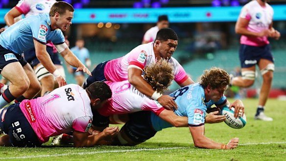 Will Harris scores a try against the Melbourne Rebels.
