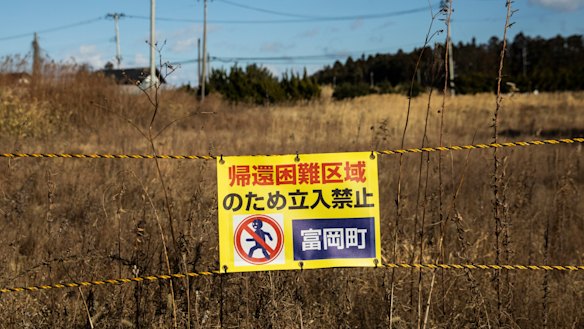 A sign reads "Do not enter" along Route 6 in Tomioka near the Fukushima Daiichi nuclear plant. 