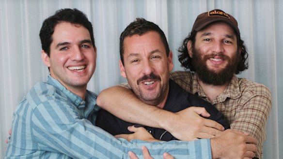 Adam Sandler, centre, with co-directors Benny Safdie, left, and his brother Josh at the International Film Festival in Toronto. 