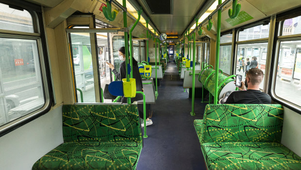 A near-empty tram travels along St Kilda Road in Melbourne. More people working from home could see demand for public transport fall.
