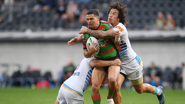 Cody Walker of the Rabbitohs is tackled by Kevin Proctor of the Titans during the Round 5 NRL match between the South Sydney Rabbitohs and the Gold Coast Titans at Bankwest Stadium.