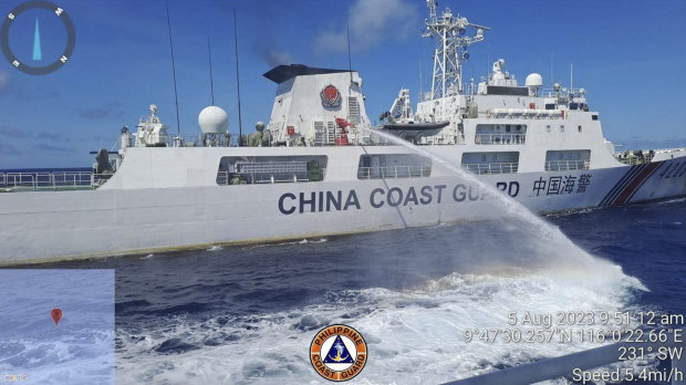 A Chinese Coast Guard ship aims a water cannon at a Philippine military resupply boat near Second Thomas Shoal in the Spratly Islands on August 5.