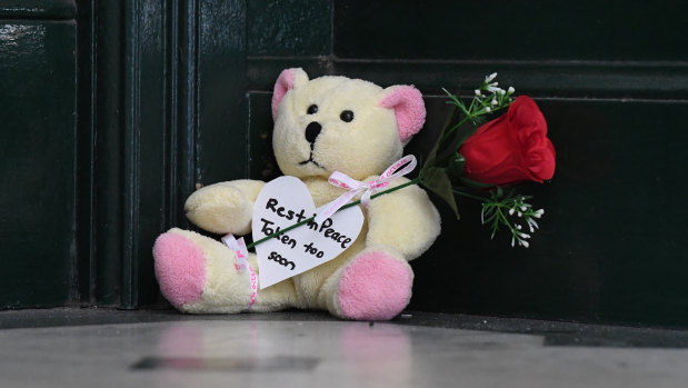 A teddy bear and rose left on the steps of Clarence House after Michaela Dunn was killed there on Tuesday.