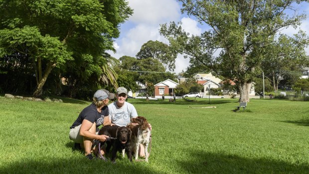 Acacia and Sarah with their dogs at the park.