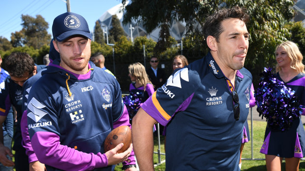 Bitter pill: Cameron Munster, left, and Billy Slater arrive at the Storm's fan day on Monday. 
