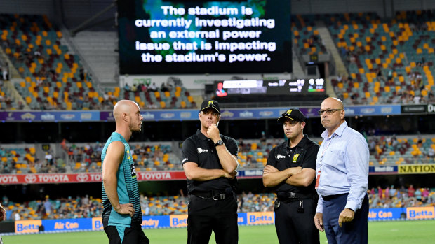 Blackout: Chris Lynn of the Heat talks to match officials after play was abandoned at the Gabba in the result that ultimately cost the Thunder.