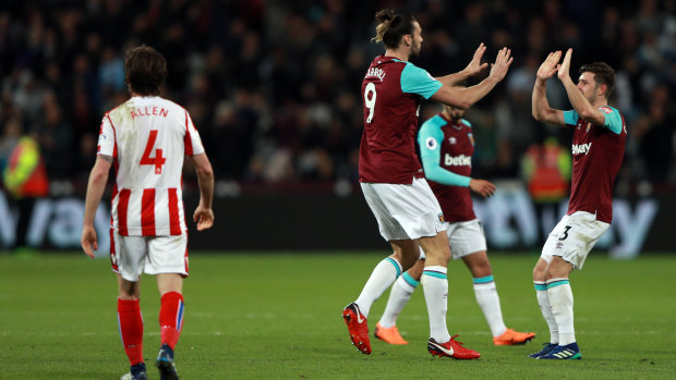 Happy returns: West Ham United's Andy Carroll (centre) celebrates scoring the equaliser.