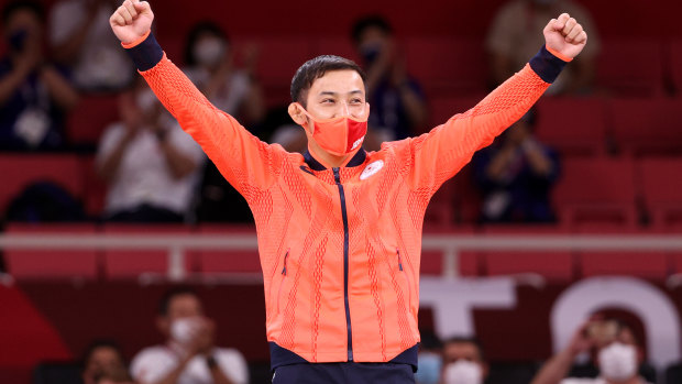 Naohisa Takato of Japan, poses with the gold medal.