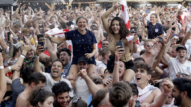 Coming home? England fans whoop it up in London after the match.