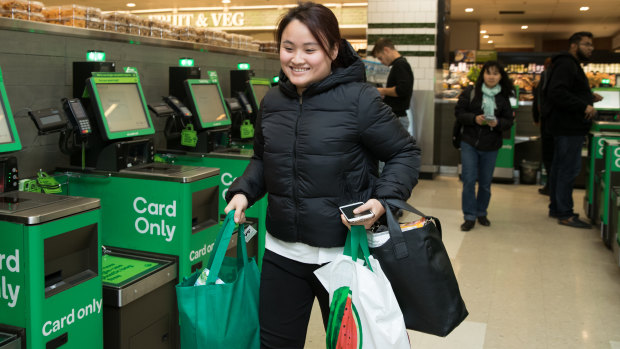 Sylvia Bui, a nursing student, leaving a Woolworths store in central Sydney with her reusable shopping bags on Wednesday.