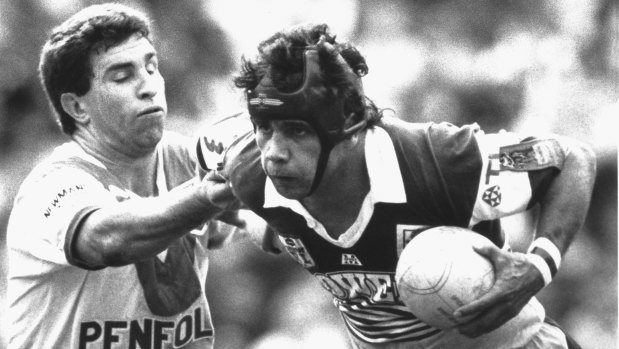Brisbane Broncos player Steve Renouf  (right) fends off a St George defender during his 90-metre try in the 1992 rugby league grand final at the Sydney Football Stadium.