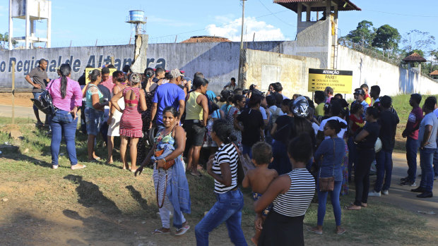 People seek information about family members who are prisoners after a riot inside the Regional Recovery Centre in Altamira, Brazil.