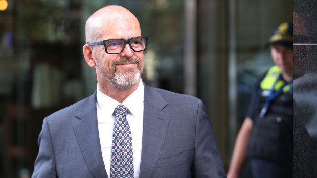 Simon Overland leaving the royal commission on December 18, 2019.