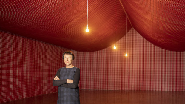 Cornelia Parker inside The War Room, constructed from the offcuts of remembrance poppies.