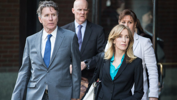 Actress Felicity Huffman exits federal court in Boston on Wednesday.