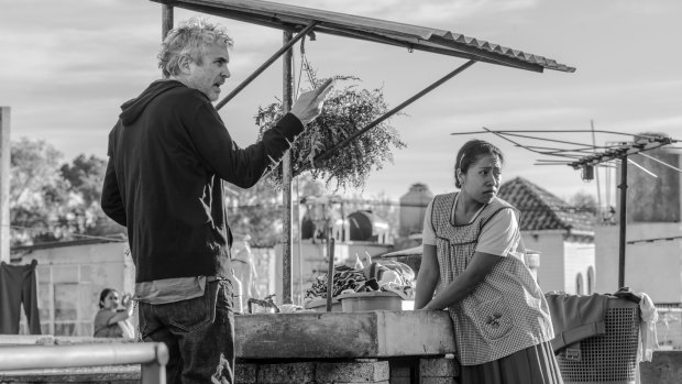 Four-time nominee Alfonso Cuaron, left, and best actress contender Yalitza Aparicio on the set of Roma. 