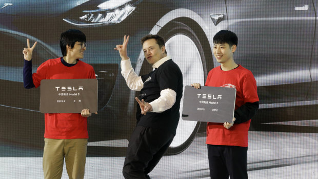 Elon Musk tries to woo the growing market in China for his Tesla EVs.