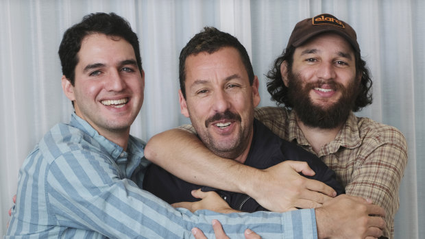 Adam Sandler, centre, with co-directors Benny Safdie, left, and his brother Josh at the International Film Festival in Toronto. 