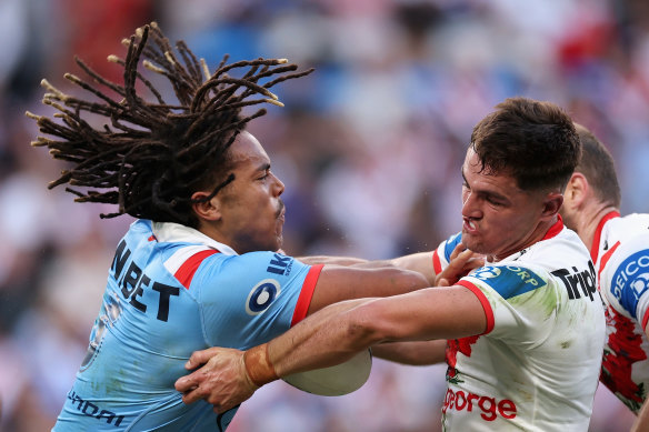 Dominic Young fends off Kyle Flanagan at Allianz Stadium.