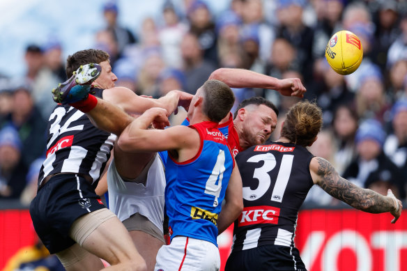 Steven May crashes a pack in the King’s Birthday clash against Collingwood.