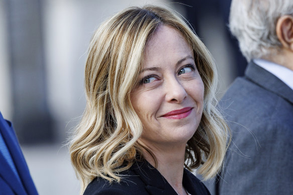 Italian Premier Giorgia Meloni arrives at the tomb of the unknown soldier for the solemn Liberation Day commemoration, in Rome.