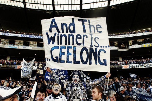 Geelong fans celebrate the win.