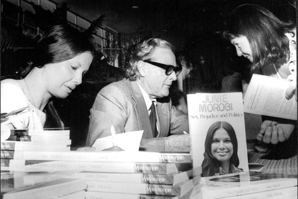 "Juni Morosi and Dr. Cairns autograph copies of their books for Shoppers at Roselands today." November 24, 1975