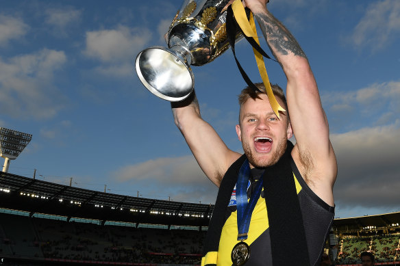Brandon Ellis of the Tigers celebrates with the 2019 Premiership Cup.