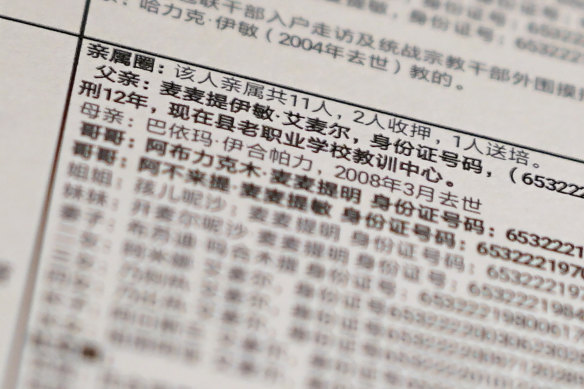Details from a leaked database that offers an insight into how Chinese officials decide who to put into detention camps. The text reads: "Family circle: Total relatives 11, 2 imprisoned, 1 sent to training, Father: Memtimin Emer ... sentenced to 12 years [and] is now in the training centre at the old vocational school." 
