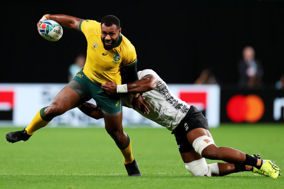 Kerevi is tackled by Dominiko Waqaniburotu during Australia’s World Cup win over Fiji.
