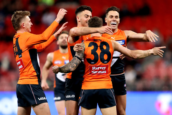 Rout: Daniel Lloyd celebrates one of GWS’s many goals.