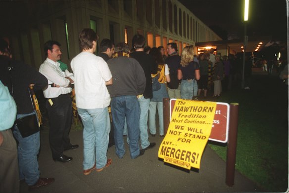 A queue of Hawthorn members waiting to get into the club merger meeting at Camberwell Civic Centre.