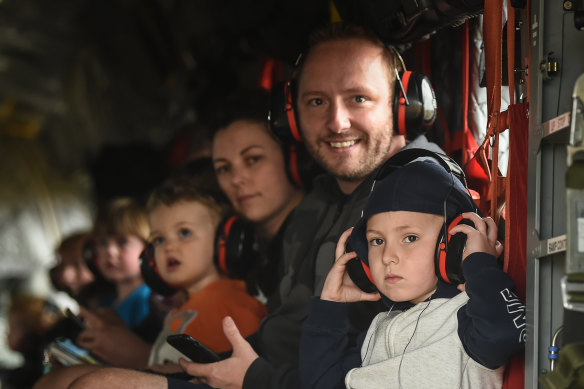 Tim Buckley and son Jackson on board a Chinook helicopter with their family Meaghan Wegg and Georgia.