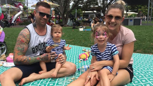 Aaron Roberts, partner Dimity and daughters Charlotte and Sophie say growing South Bank around the river would be too far to walk for small children.