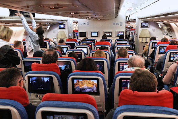 Passenger cabin economy class interior onboard Turkish Airlines Airbus A330.